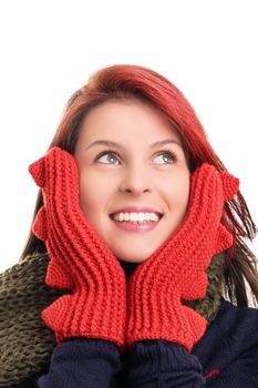 A portrait of a smiling beautiful young girl in red winter gloves, isolated on white background.