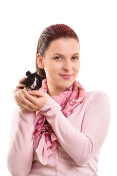 A portrait of a young beautiful girl with her guinea pig, isolated on white background.