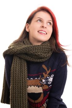 Portrait of a beautiful happy young girl in Christmas sweater and a knitted scarf, isolated on white background.