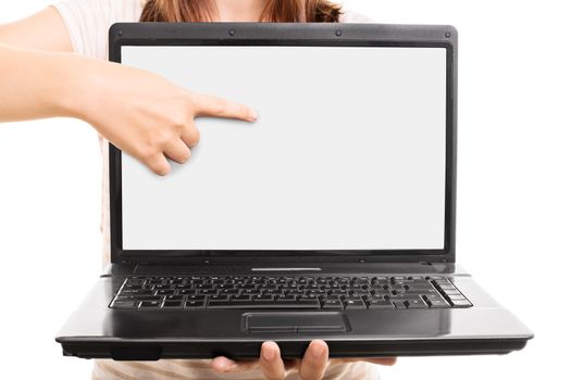 Close up shot of a young girl pointing at a blank laptop screen, isolated on white background.