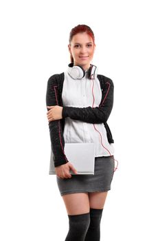 Portrait of a beautiful smiling student with headphones and a book, ready for class, isolated on white background.