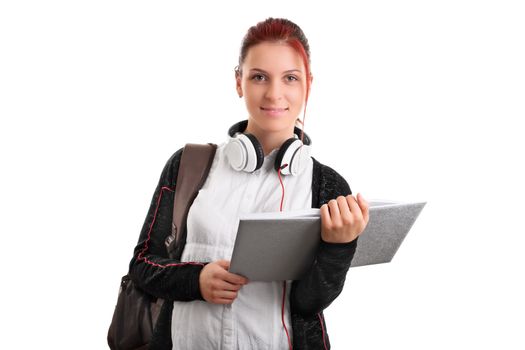 Beautiful smiling student with backpack, headphones and an open book, isolated on white background.