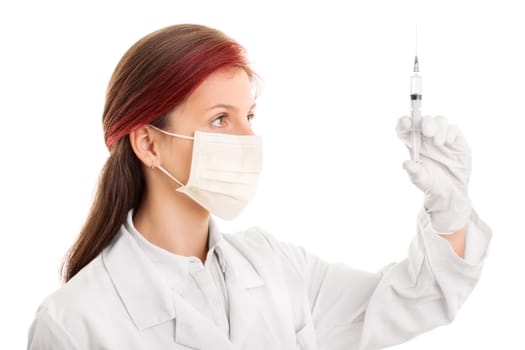 Beautiful female doctor wearing a surgical mask, holding a syringe with a needle, giving an injection, isolated on white background.