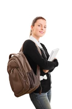 A portrait of a young female student with a backpack holding a book, isolated on white background.