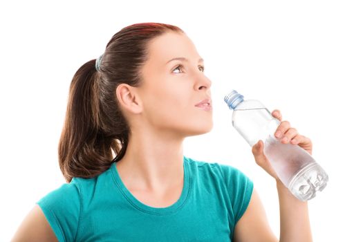 Water is life. Beautiful young girl drinking water after her workout, isolated on white background