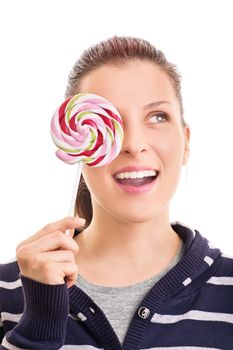 Lollipop wink. Beautiful young girl holding a colorful lollipop, isolated on white background.