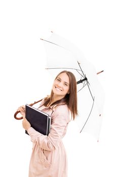 Young girl under an umbrella holding some books, isolated on white background.
