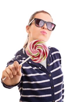 My sweet, sweet lollipop. Beautiful young girl wearing sunglasses, holding a colorful lollipop, isolated on white background.