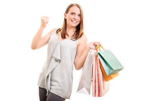 I bought myself what I always wanted. Excited beautiful young girl with shopping bags, isolated on white background.