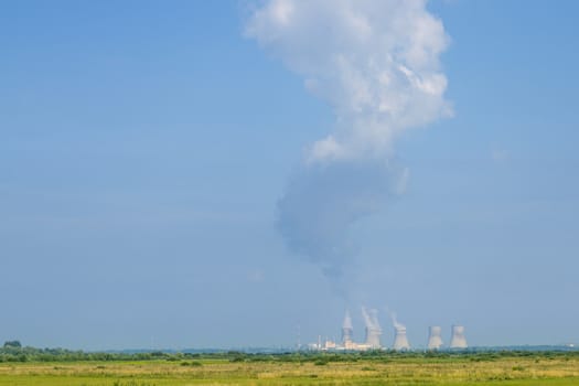 NPP like Chernobyl working far. Soviet nuclear station. Power plant produces electricity