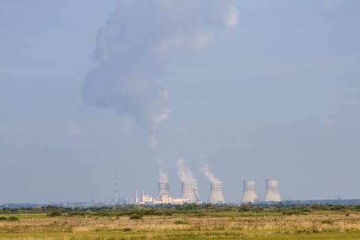 Radiation nuclear station like Chernobyl. NPP working far. Soviet nuclear station. Power plant produces electricity