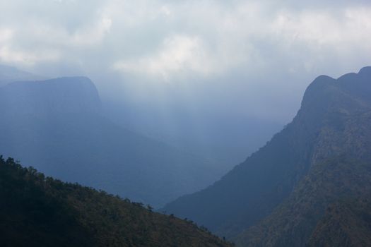 Mountains and valleys covered in cloudy mist during an overcast day, Limpopo, South Africa