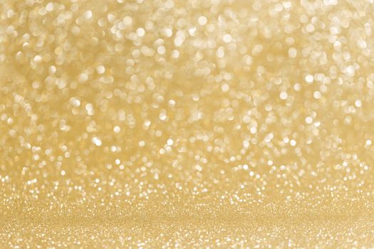 Abstract shining glitters golden holiday bokeh background with copy space for text