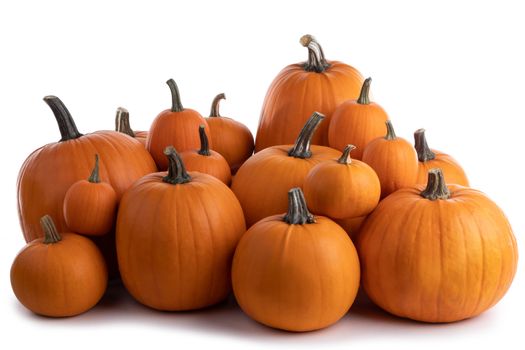 Heap of many orange pumpkins isolated on white background, Halloween concept