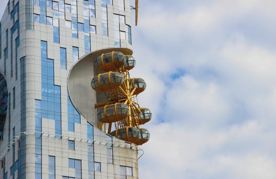 Batumi Tower and carousel against a cloudy sky, Batumi, Georgia