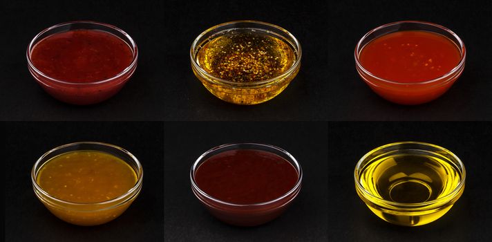 Set of different sauces isolated on black background