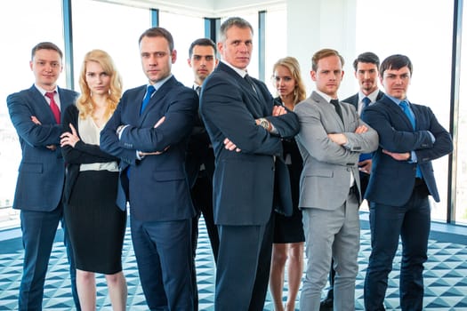 Portrait of business people people standing with arms crossed in office