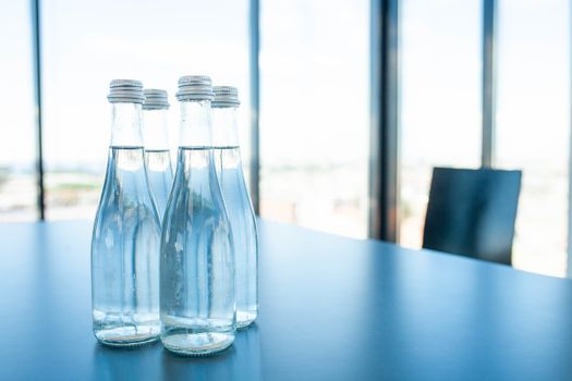Conference room table for business meeting with bottles of water