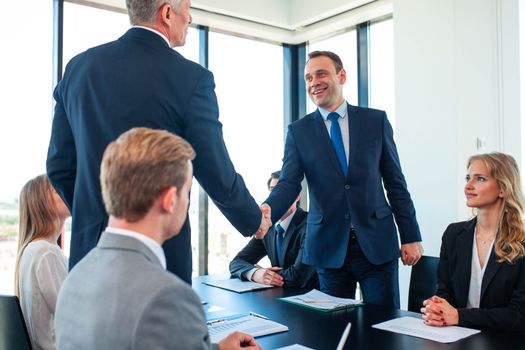 Business people shaking hands, finishing up a meeting