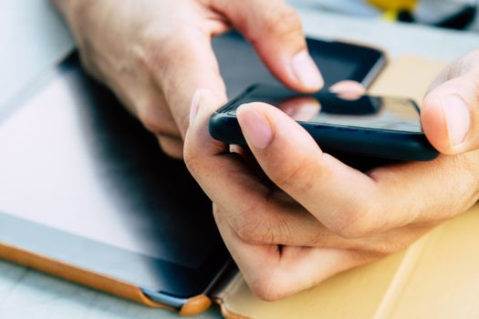 close up image of Phone on hands.