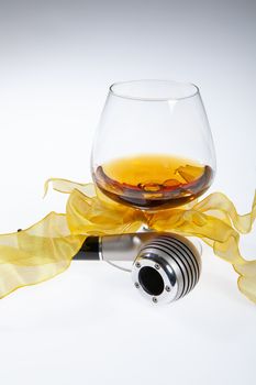 Glass with cognac on an isolated studio background