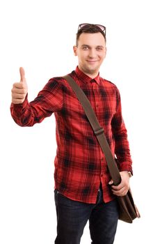 A portrait of a male student with a shoulder bag giving a thumbs up, isolated on white background.