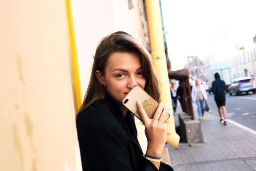 Beauty young woman against midday town background