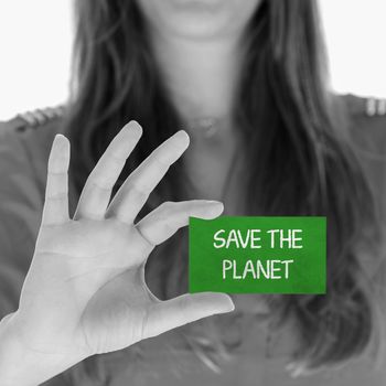 Woman showing a small message: Save the planet