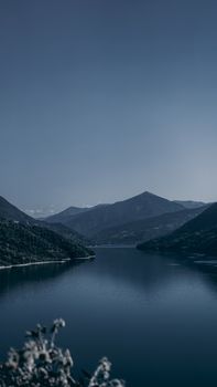 Zhinvali reservoir lake landscape with mountains . The main Caucasus ridge.