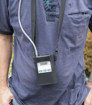 man wearing a conitious blood pressure instrument that also check heart rate