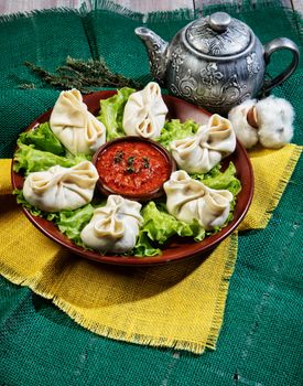 Traditional eastern food manty on an old wooden desk
