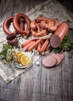 Ham and different vegetables on a studio background