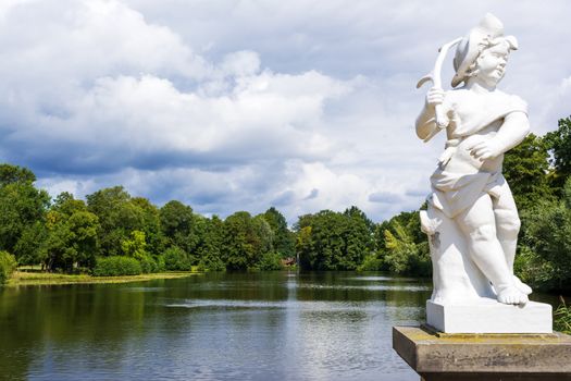 Statue at the lake of Schlossgarten Charlottenburg in Berlin. Germany.