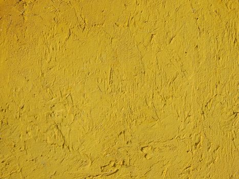 Grunge yellow background wall texture.