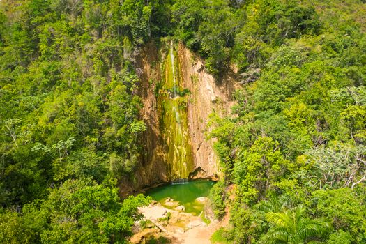 Scenic aerial view of El Limon waterfall in jungles of Samana peninsula in Dominican Republic. Amazing summer look of cascade in tropical forest from above close up.