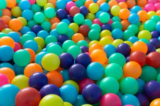 Colorful plastic balls for children playing in playground room.