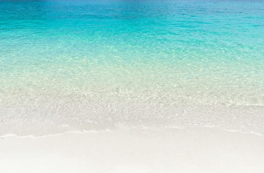 Tropical summer beach and transparent blue sea water background. Thailand sea.