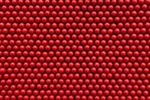 Abstract dots background in red colors. Red is the color of fire and blood, so it is associated with energy, war and danger.