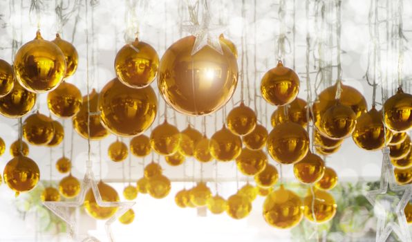Bright Christmas balls, yellow and gold background for the Christmas design ideas.