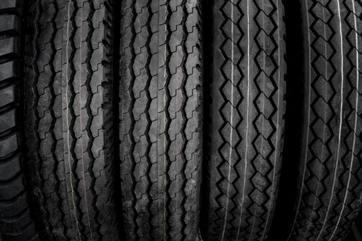 The background and texture of large tires that have been used and repaired for re-use.