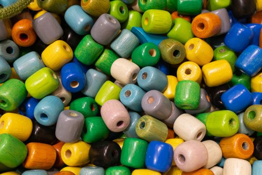 Colorful wooden beads that are toys for children