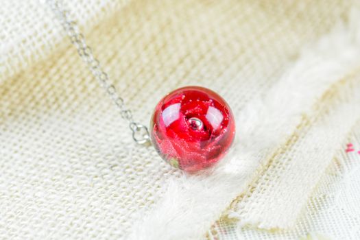 Dried rose in crystal clear resin pendant necklace, pendant with a real rose. 
