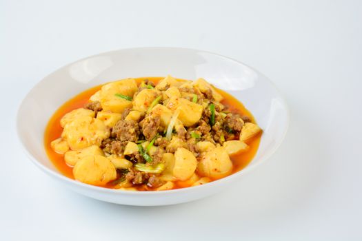 Mapo Tofu, popular Chinese dish.  The classic recipe consists of silken tofu, ground pork or beef and Sichuan peppercorn to name a few main ingredients.
