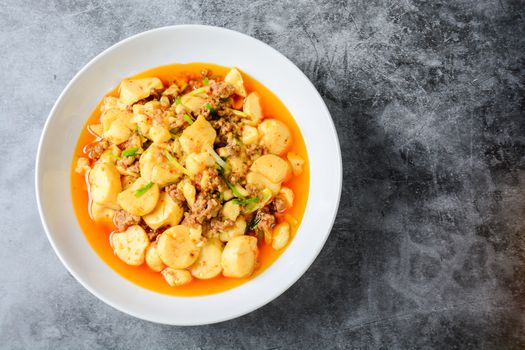 Mapo Tofu, popular Chinese dish.  The classic recipe consists of silken tofu, ground pork or beef and Sichuan peppercorn to name a few main ingredients.
