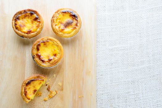 Portuguese Egg Tarts, is a kind of custard tart found in various Asian countries. The dish consists of an outer pastry crust and is filled with egg custard and baked.
