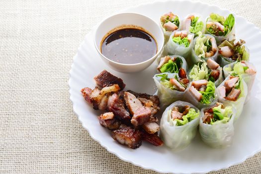 Fresh assorted Asian spring rolls with grilled pork, fresh vegetable. Healthy and delicious dish
