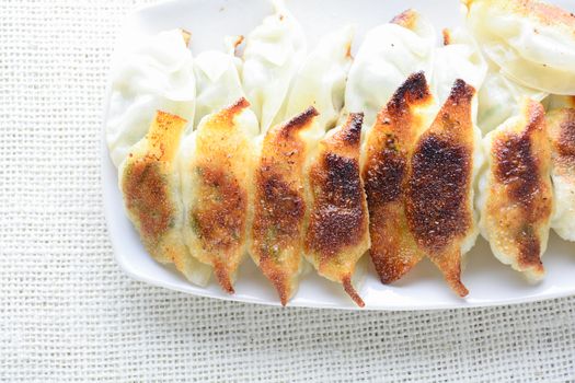 Japanese Fried Dumplings, the half moon-shaped dumplings served in Asian restaurants as an appetiser or side dish, pork and vegetable filling.
