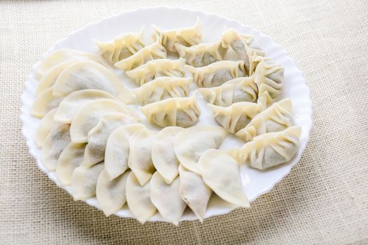 Japanese Fried Dumplings, the half moon-shaped dumplings served in Asian restaurants as an appetiser or side dish, pork and vegetable filling.
