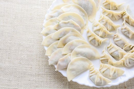 Japanese Fried Dumplings, the half moon-shaped dumplings served in Asian restaurants as an appetiser or side dish, pork and vegetable filling.
