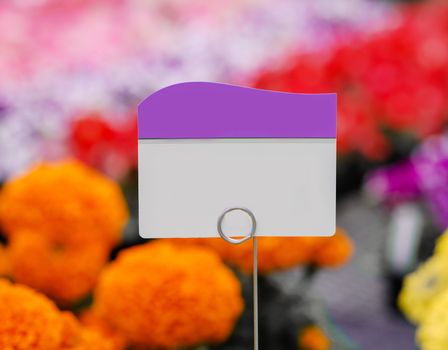 Piece of paper, tag or label with colorful flowers background
